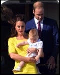 Prince William, Catherine and their son Prince George disembark at Sydney airport