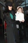 Salma Hayek pushes her daughter Valentina in a Juicy Couture baby stroller through JFK airport in New York