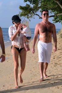 Simon Cowell & Lauren Silverman stroll on the beach in Barbados with son Eric