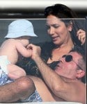 Simon Cowell and Lauren Silverman play with their son onboard a yacht in St. Tropez