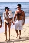 Simon Cowell and Lauren Silverman stroll on the beach in Barbados with son Eric