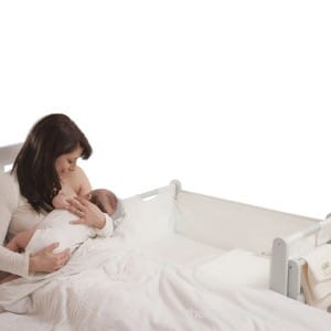 SnuzPod's 3 in 1 Bedside Crib - nursing mom