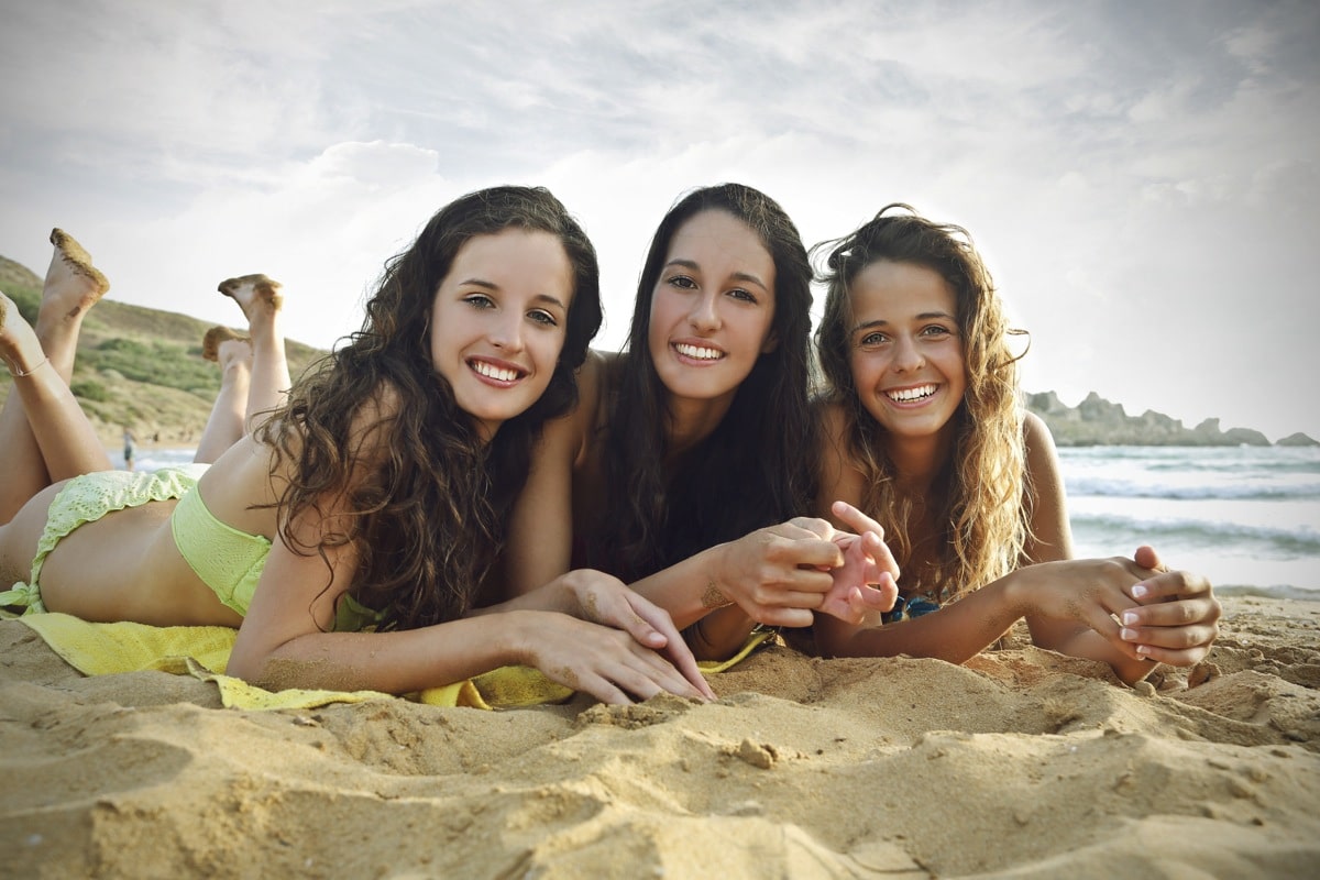 Teens Suntanning at the beach