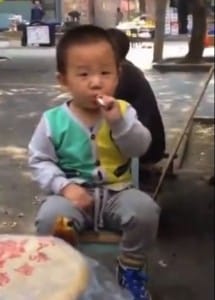 Toddler in China videotaped smoking in the streets