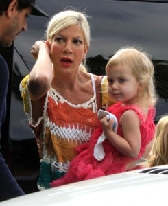 Tori Spelling carries her daughter Hattie while out shopping