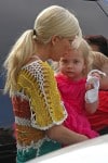 Tori Spelling carries her daughter Hattie while out shopping
