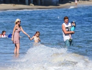 Tori Spelling with Stella, Finn and Jack at the beach in Malibu