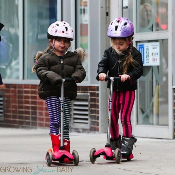 Twins Tabitha (Loretta) and Marion Broderick scoot home from school