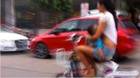 Woman Pulled Over For Breastfeeding On A Moped