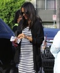 Zoe Saldana shows off a rounded tummy while out shopping