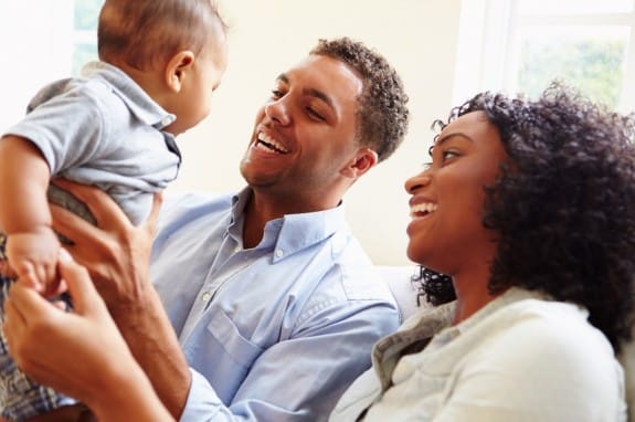 happy baby with parents