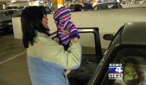 mom grabs her Forgotten baby from the car