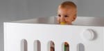 toddler in the Moodelli Baby Box